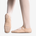 Light pink ballet shoe with rounded toe and heel pads, elastic strap and split sole