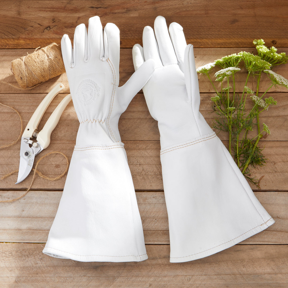 White goatskin gauntlet gloves, stitched cuffs and finger panels, pair view