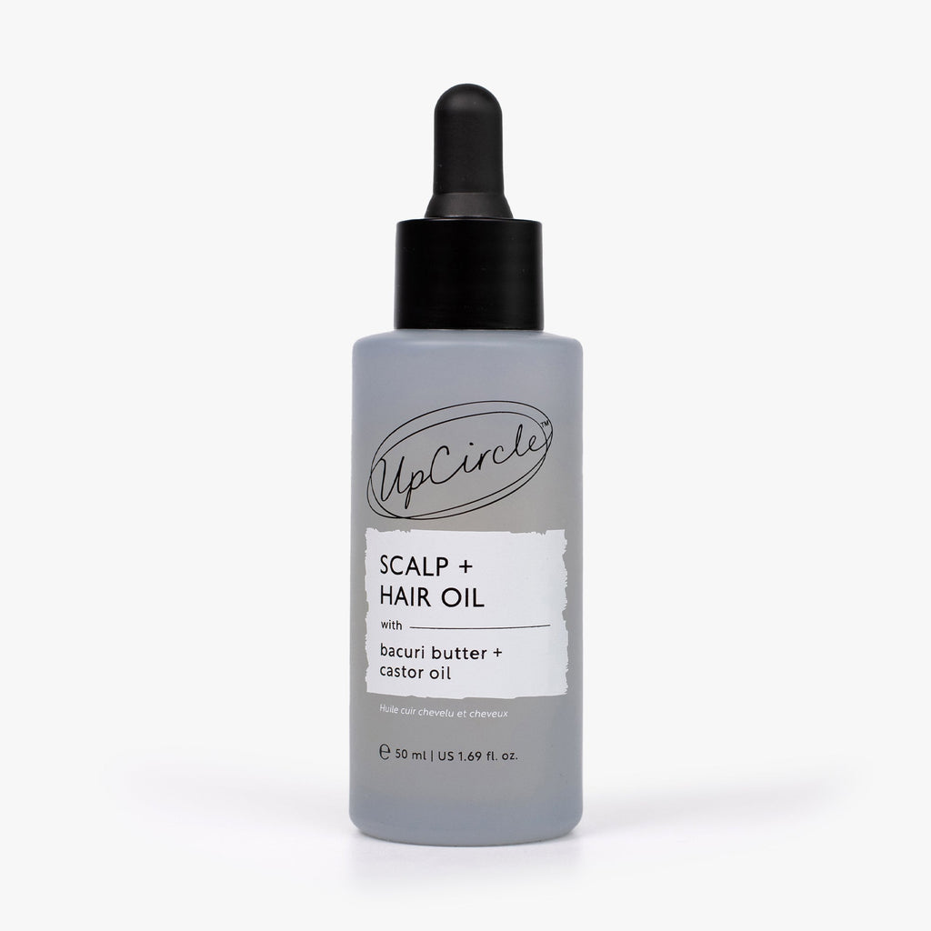 Scalp and hair oil bottle with black dropper, light lavender container