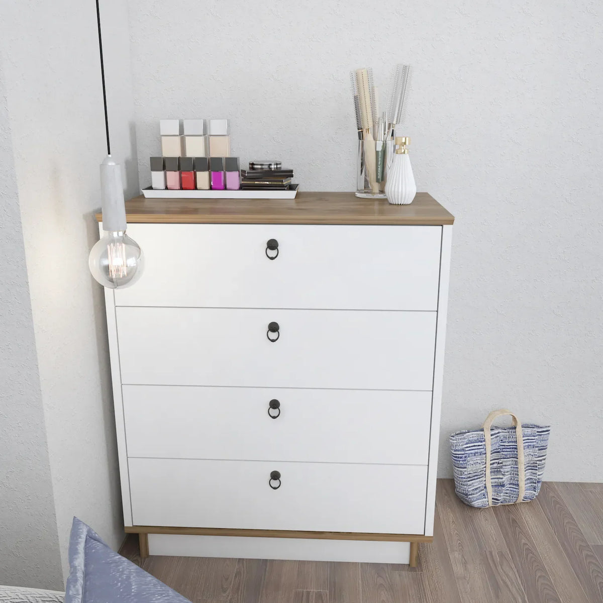White dresser with four drawers and wood top, black oval drawer pulls