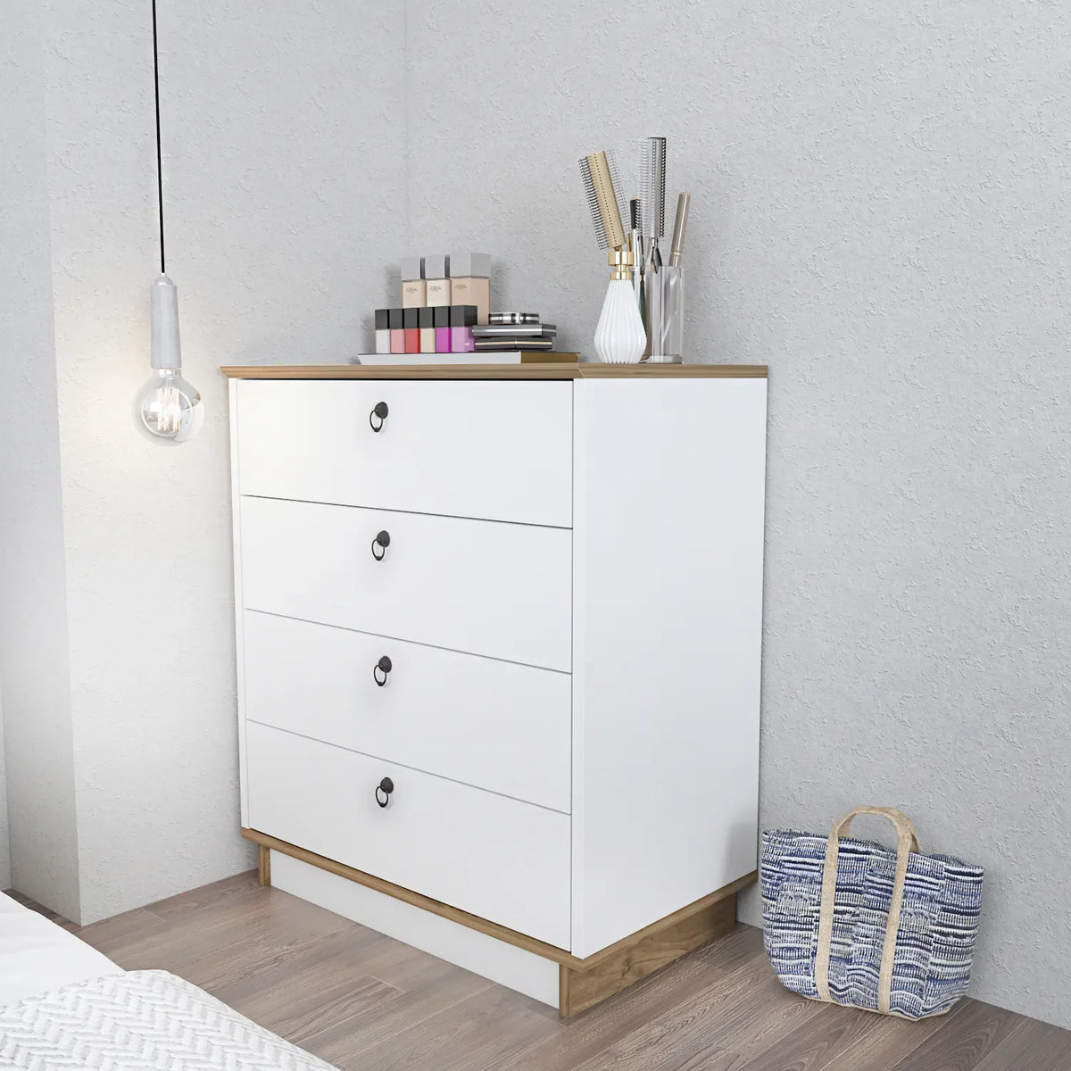 White dresser with four drawers, light wood top, black oval handles