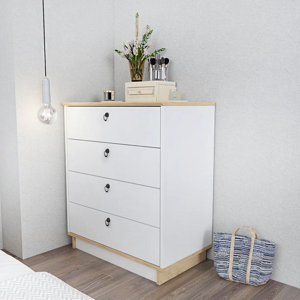 White 4-drawer dresser with wood top and black oval pulls, angled view