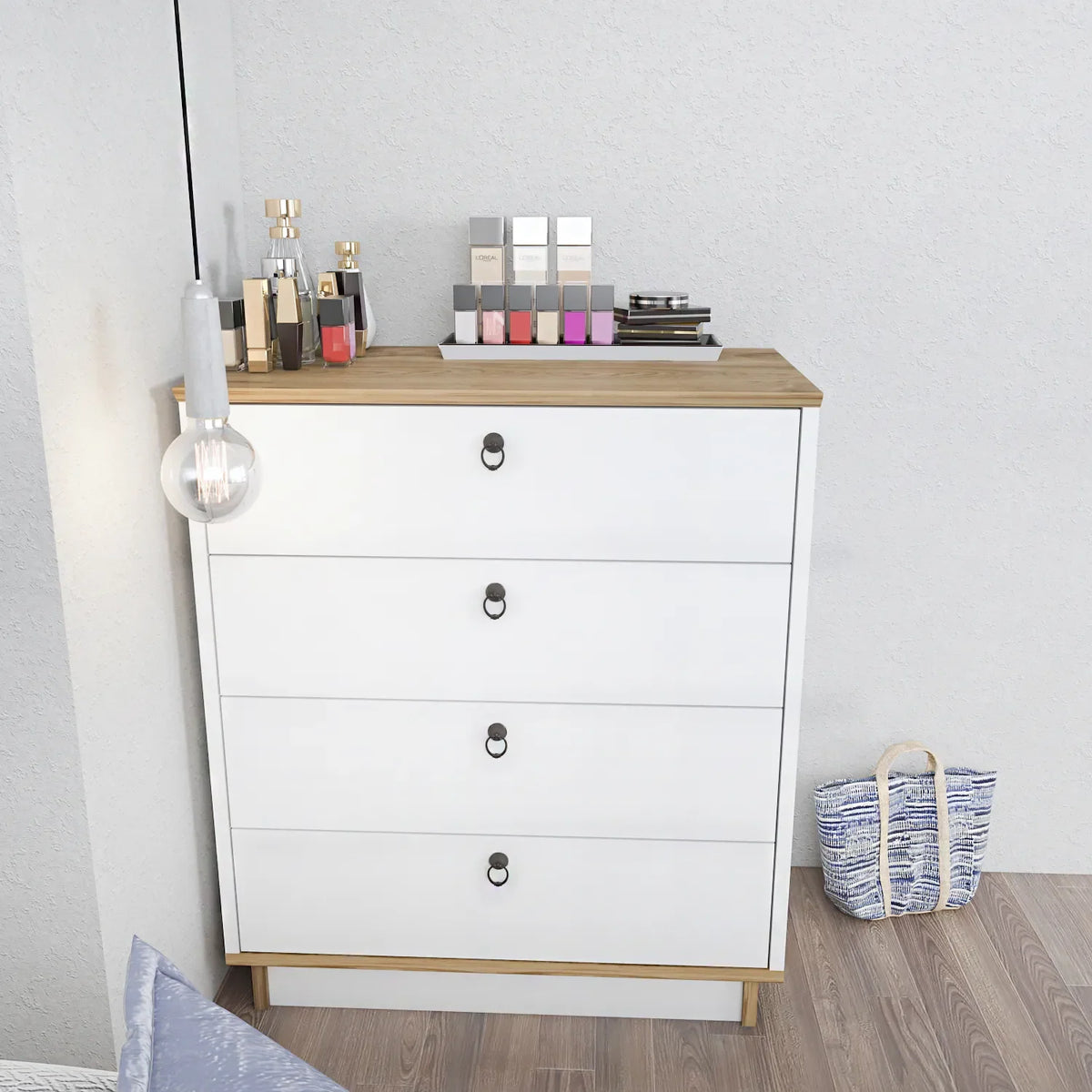 Modern white dresser with four drawers, light wood top, black oval pulls.