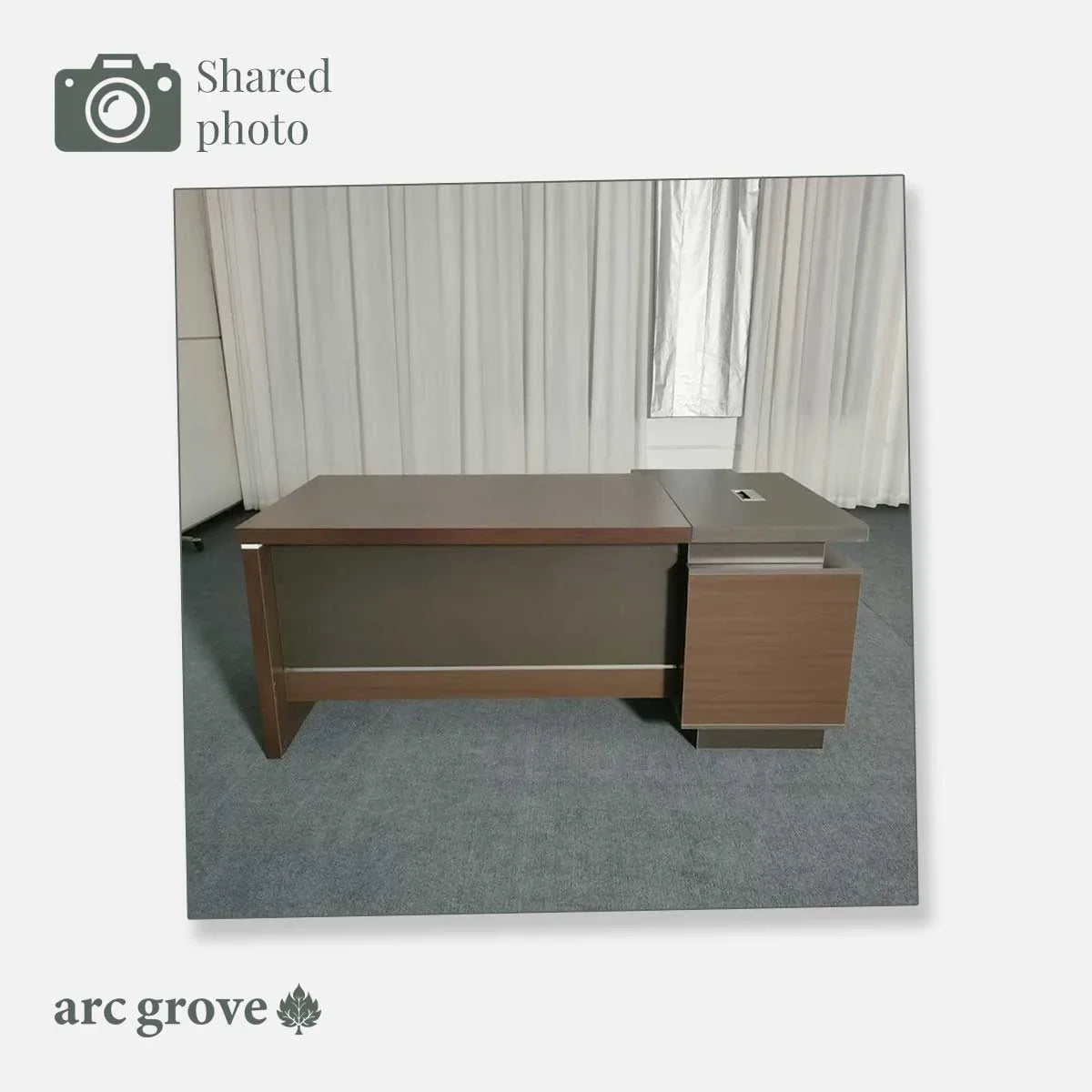L-shaped executive desk with wood top and right-side drawer pedestal