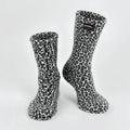 Snow leopard fleece socks with black-and-white leopard-print, crew height.