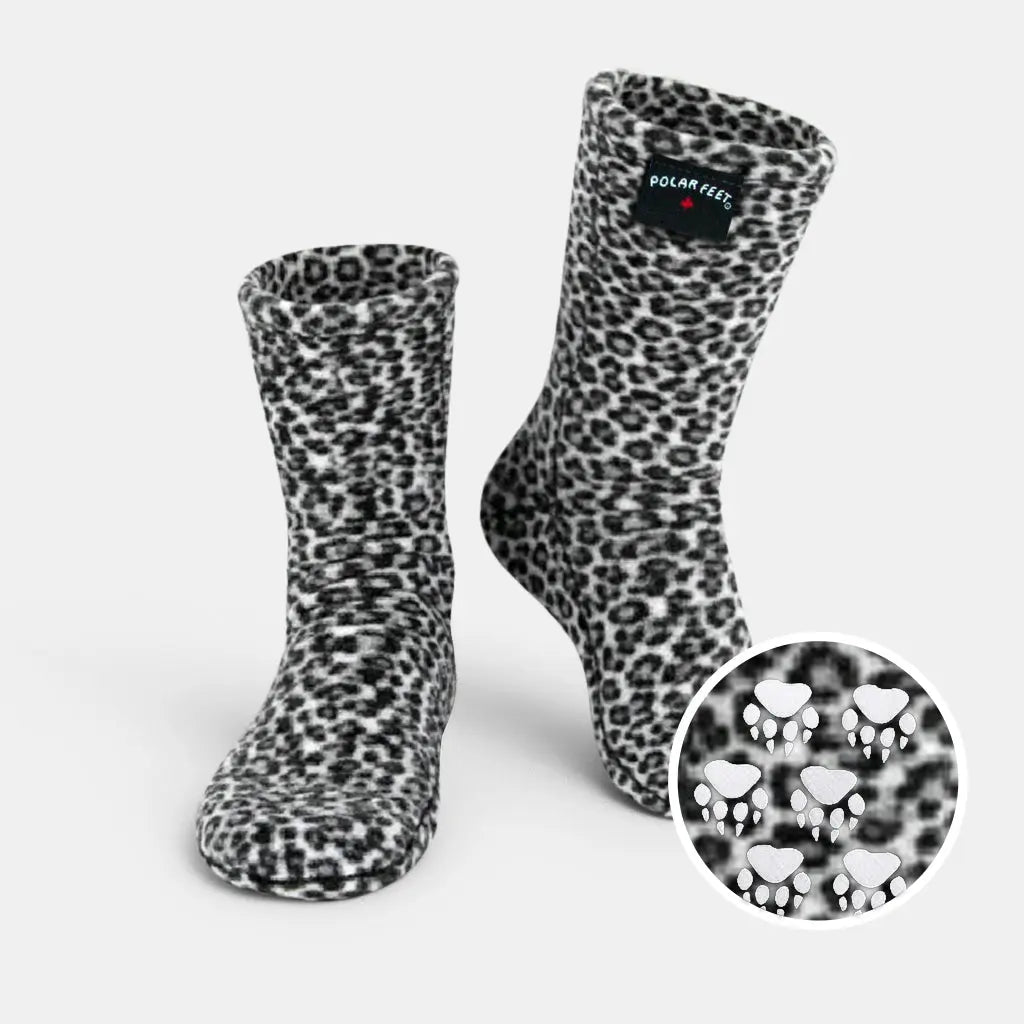 Snow leopard fleece socks with nonskid sole, crew height, black-and-white spotted print.
