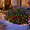 Multicolor LED net lights shaped like a hedge on snowy ground
