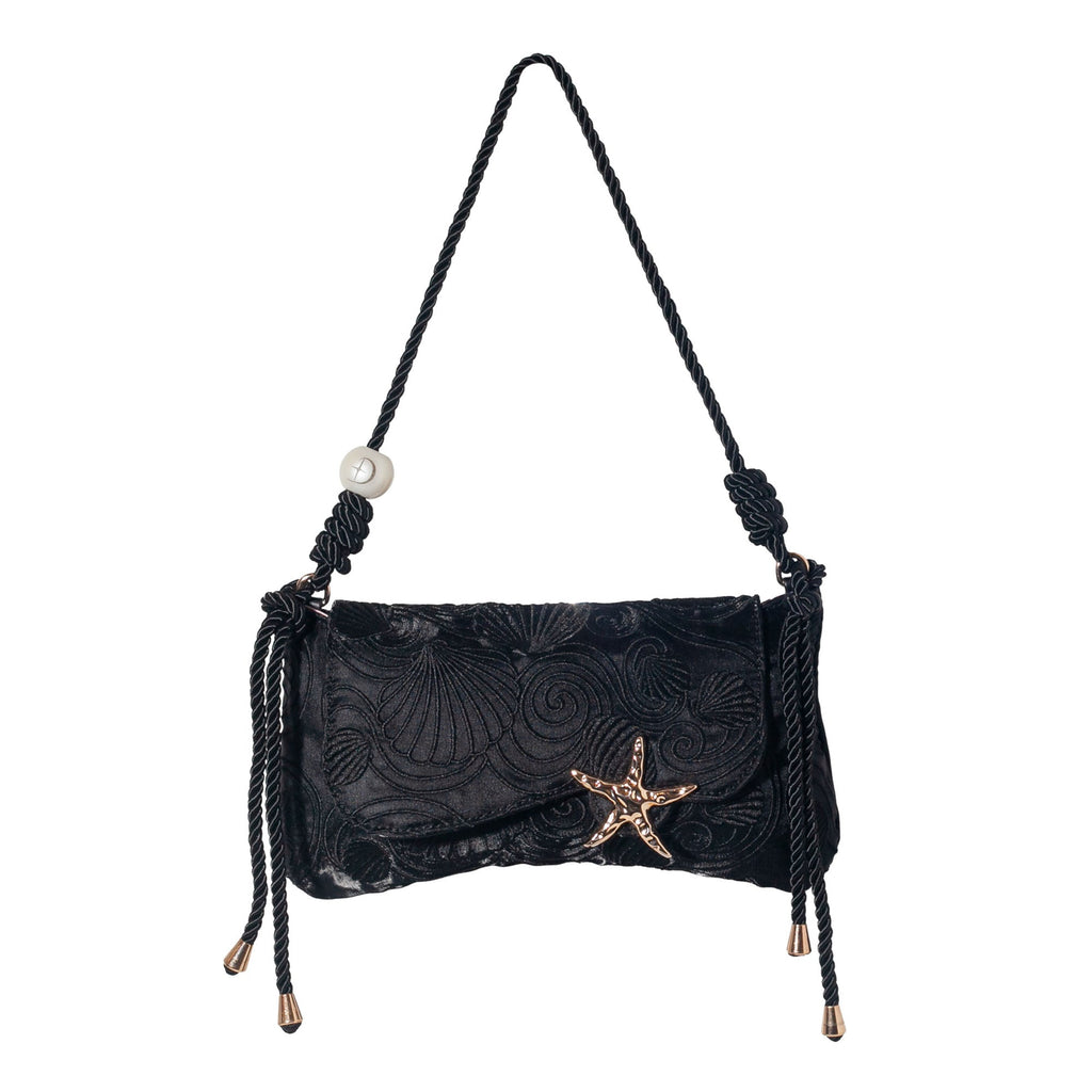 Black embroidered shoulder bag with starfish clasp and braided tassel ties