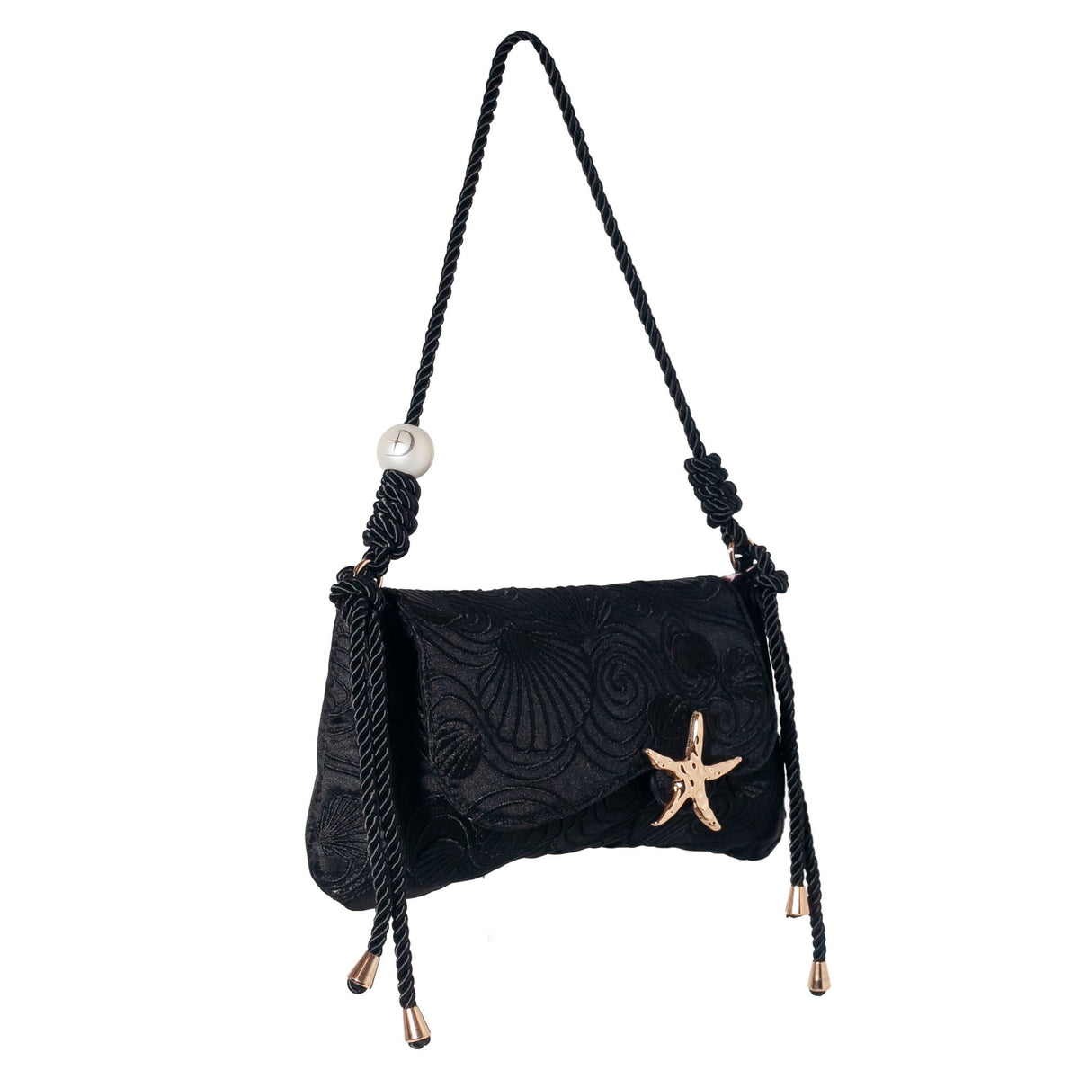 Black shoulder bag with textured surface, starfish clasp, and dangling tassel straps