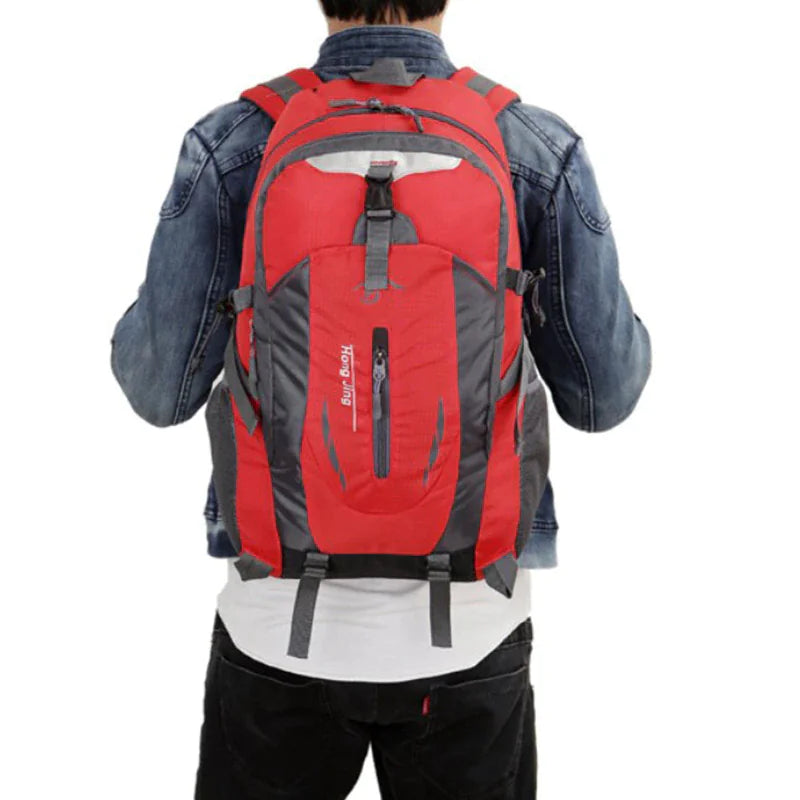 40L travel backpack with red back panel, gray accents, and adjustable padded shoulder harness