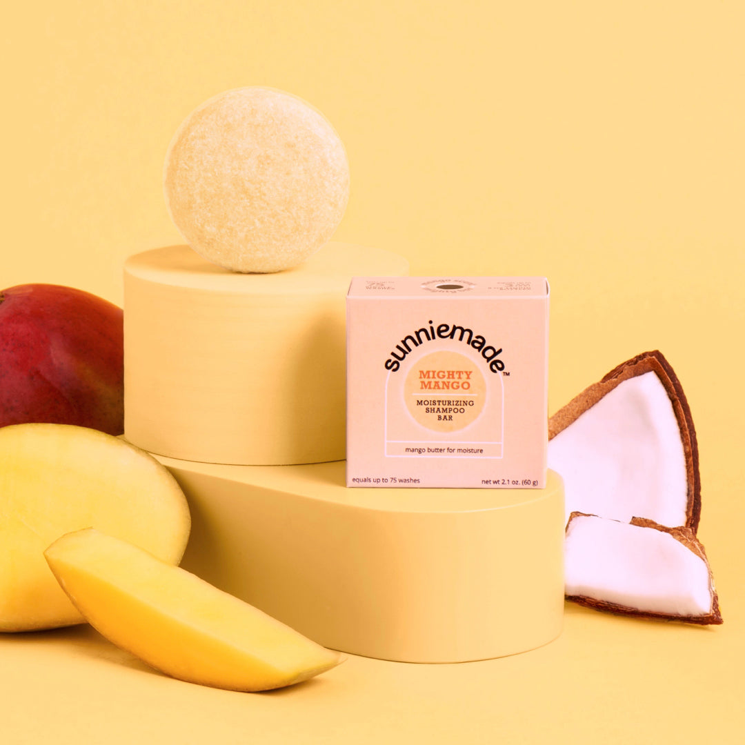 Peach moisturizing shampoo bar with Sunnimade Mighty Mango box on stacked blocks