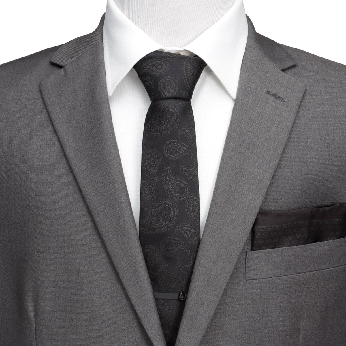 Black silk necktie with dark paisley pattern, centered on a dress shirt