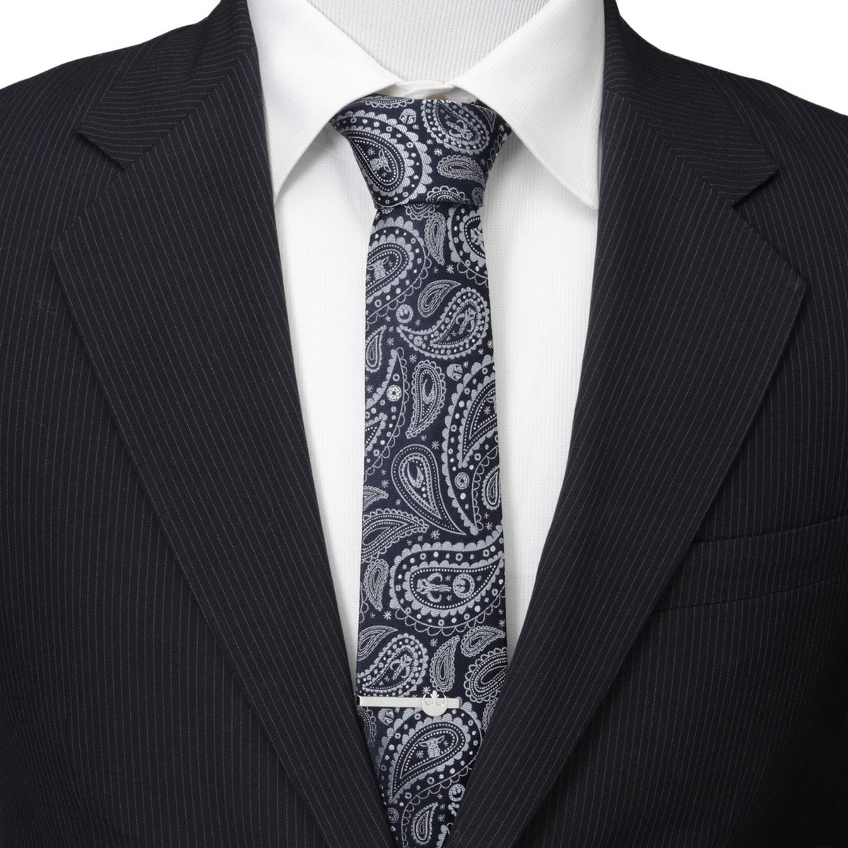 Navy paisley necktie with white ornate patterns, worn with white shirt and dark blazer