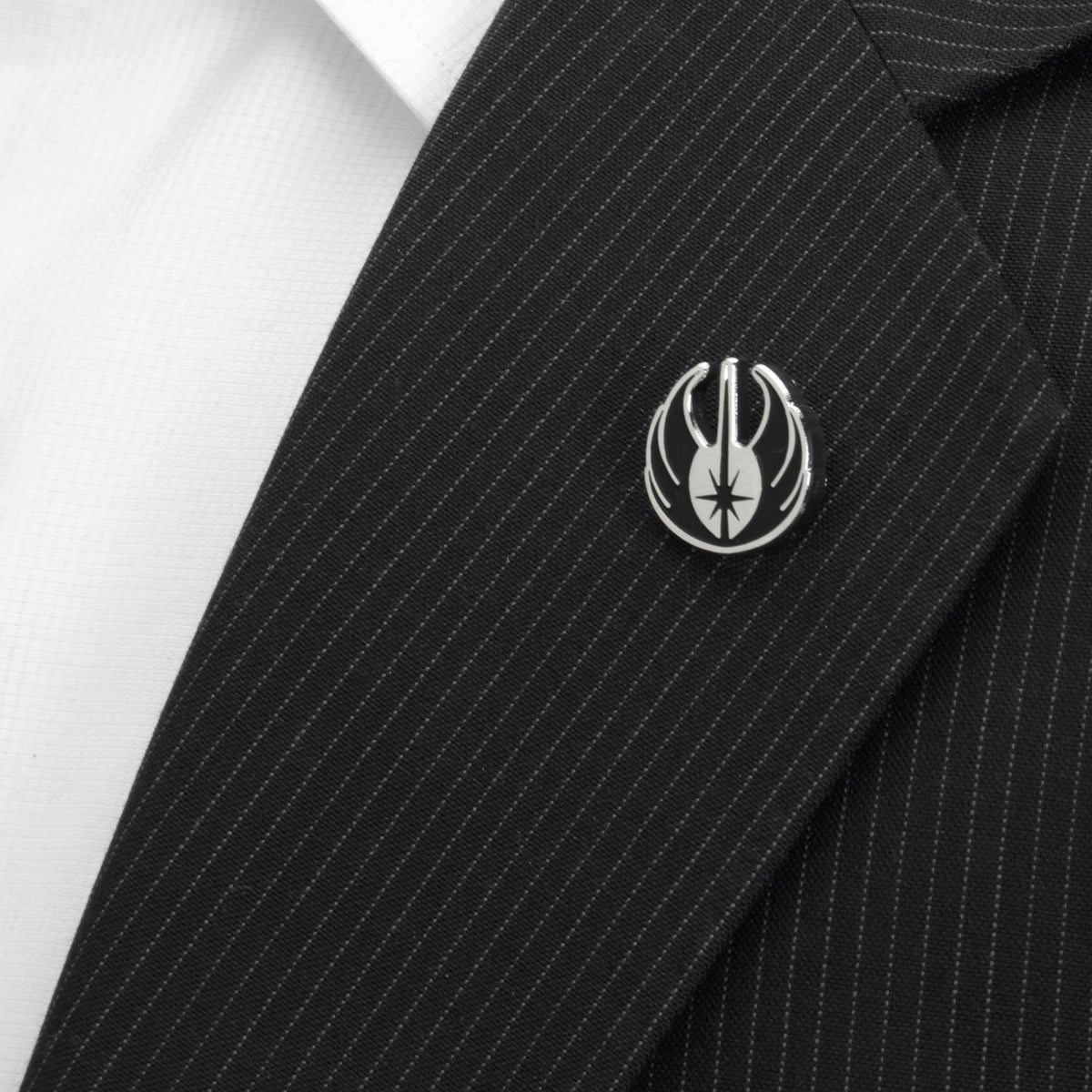 Black pinstripe fabric with silver lapel pin and flame emblem