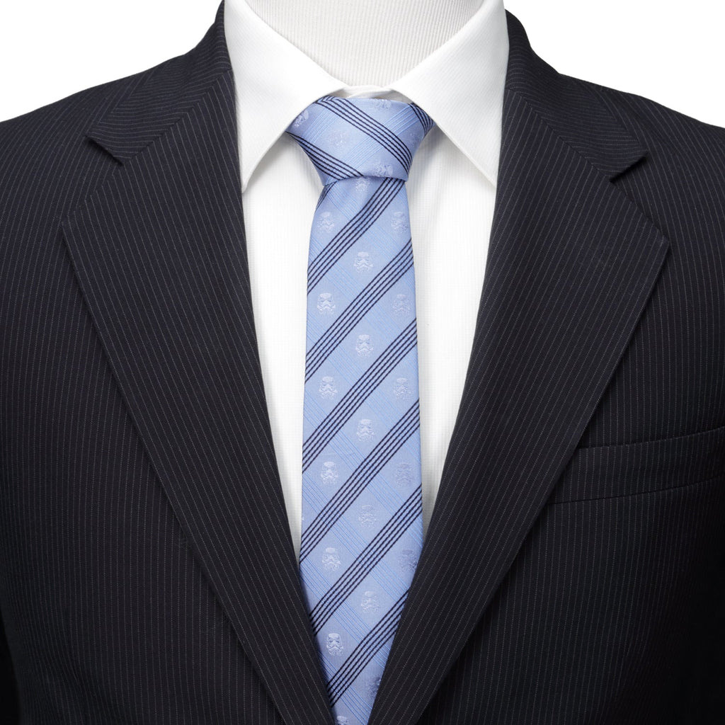 Men's light blue striped necktie paired with white shirt and dark suit jacket