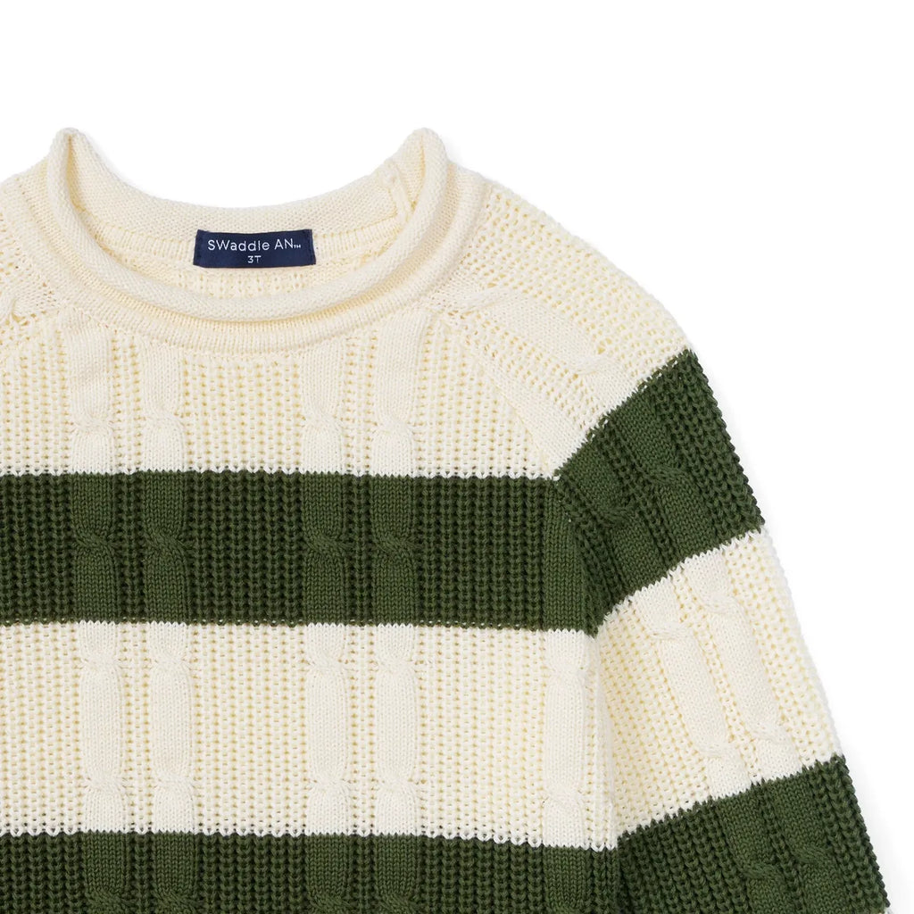 Cable knit sweater sleeve with dark green and cream horizontal stripes