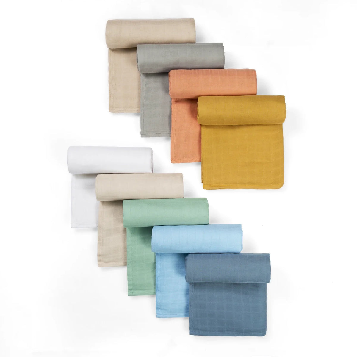 Stack of muslin swaddle blankets in multiple colors, including terra cotta