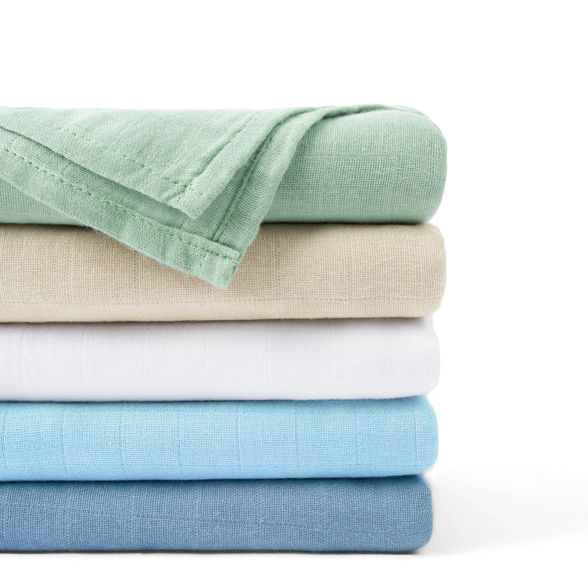 Stack of muslin swaddle blankets showing a dusty blue folded layer