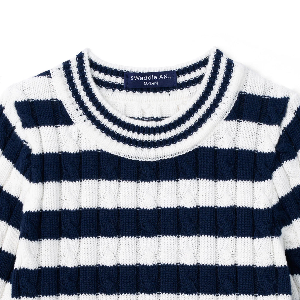 Kids striped crew-neck sweater close-up, navy-and-white ribbed collar and knit texture