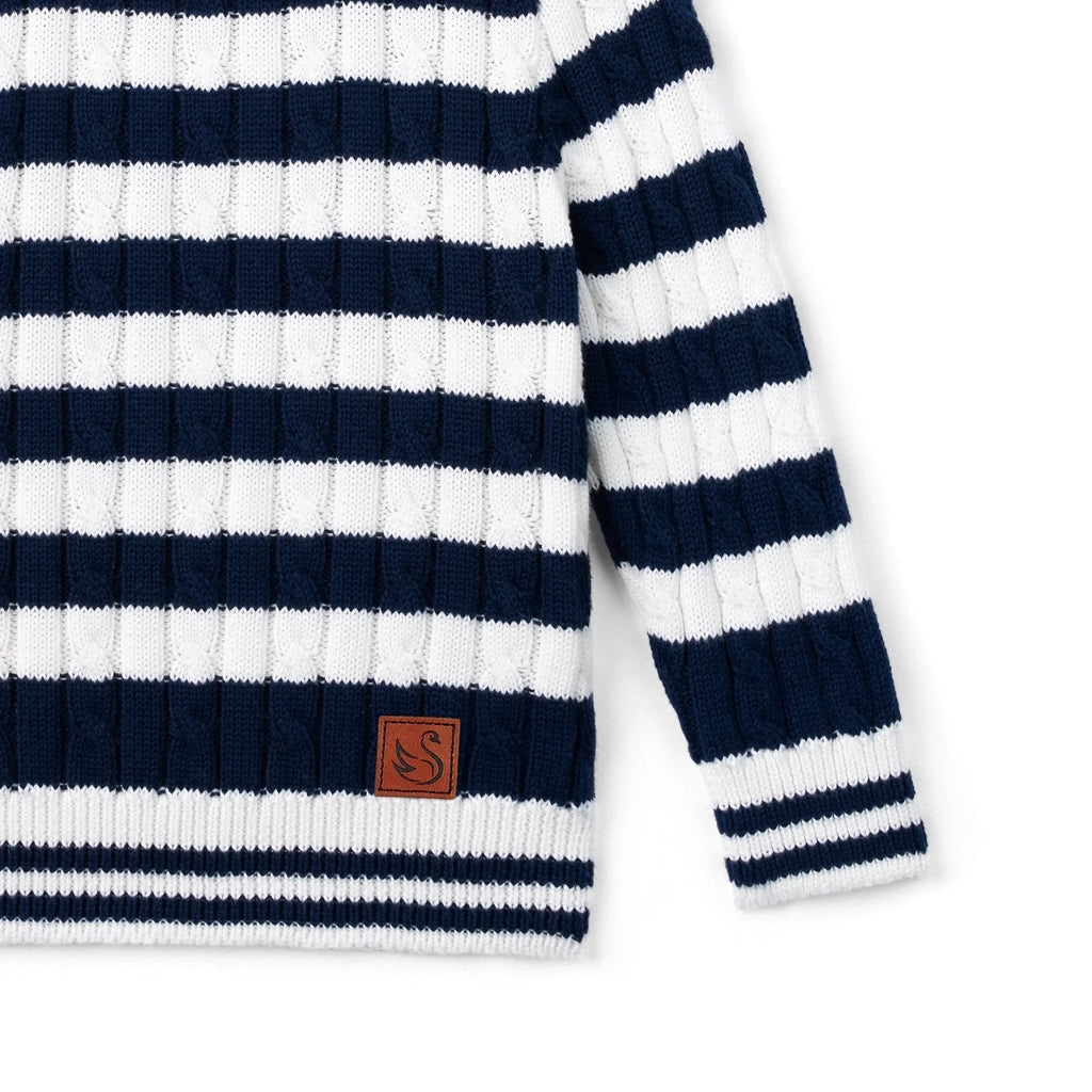 Kids striped cable-knit sweater hem detail, navy-and-white stripes with logo patch