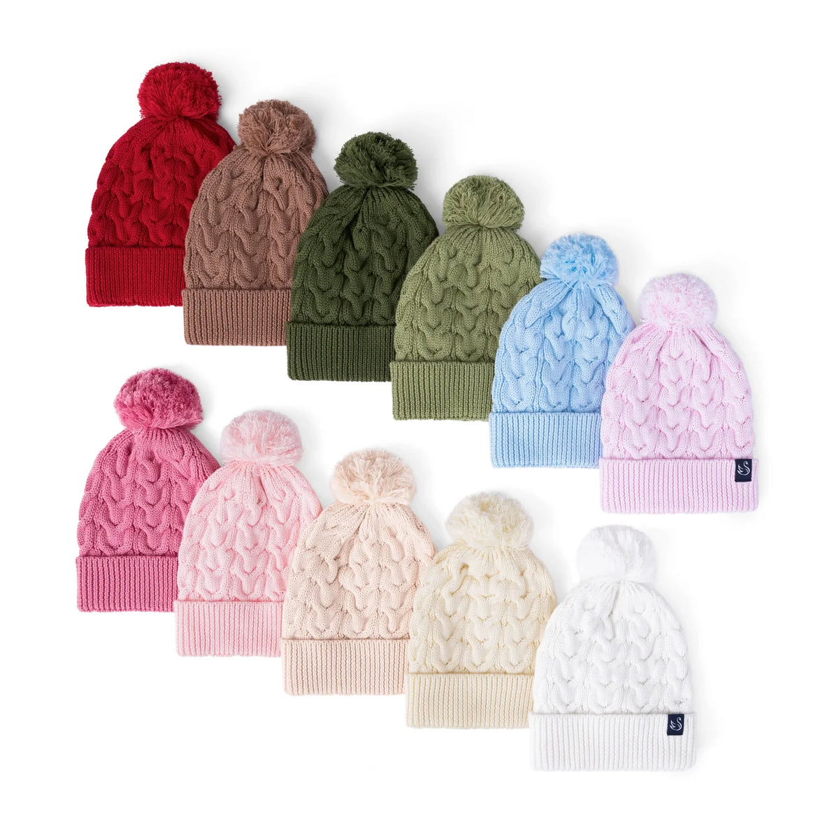Sage green cable-knit pom beanie among assorted colors, ribbed cuff and pom