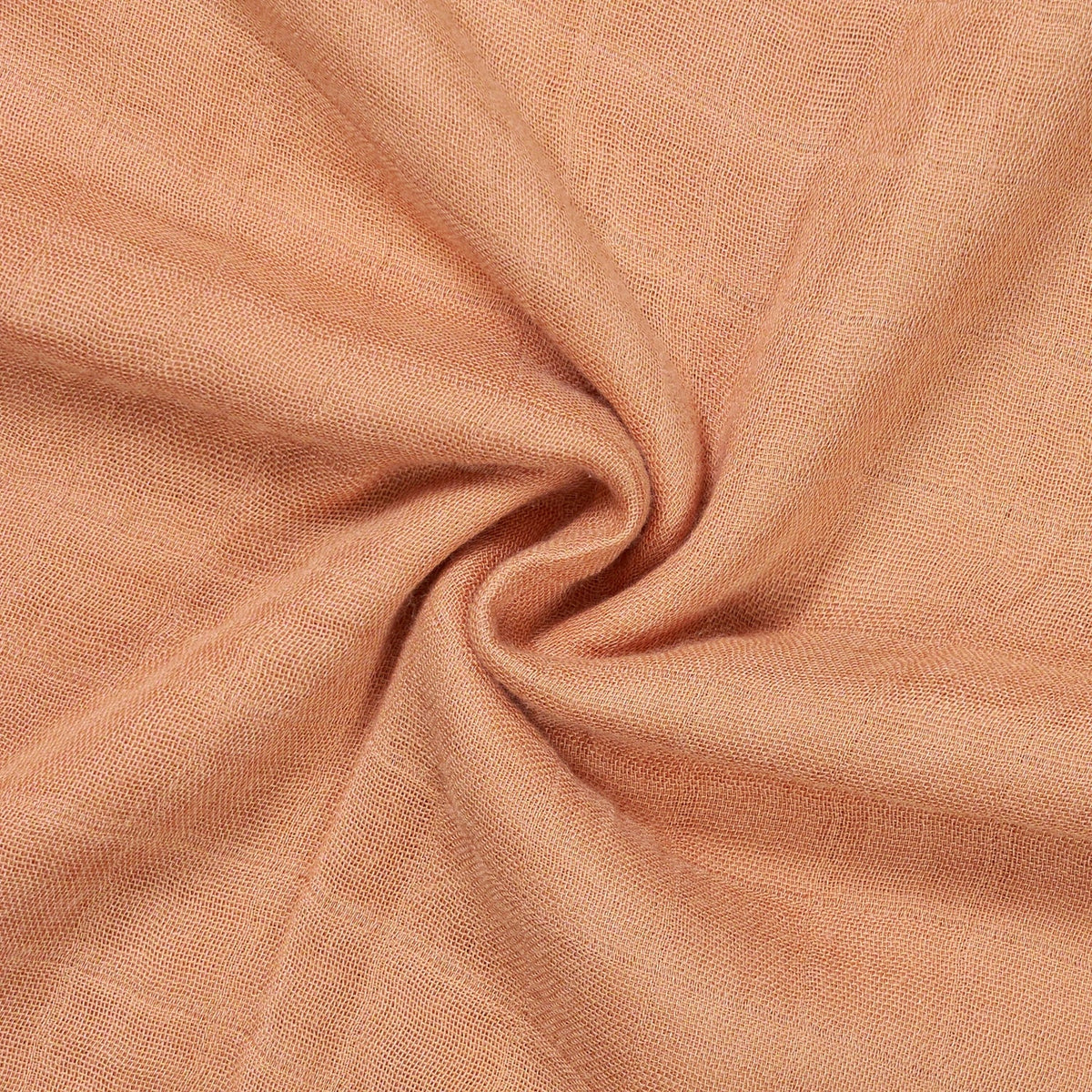 Terra cotta muslin swaddle blanket close-up of breathable textured fabric weave