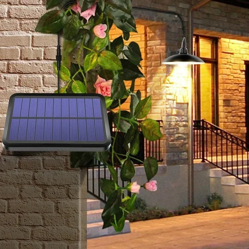 Outdoor solar pendant light with wall-mounted solar panel and hanging black lamp shade