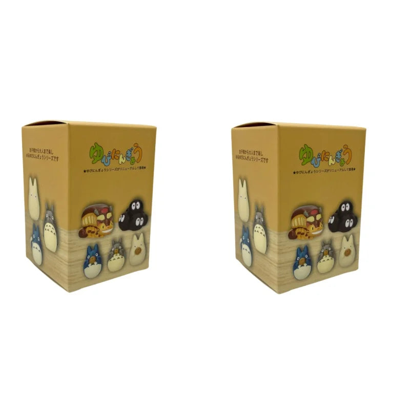 Two brown blind box display cubes showing character artwork on the front