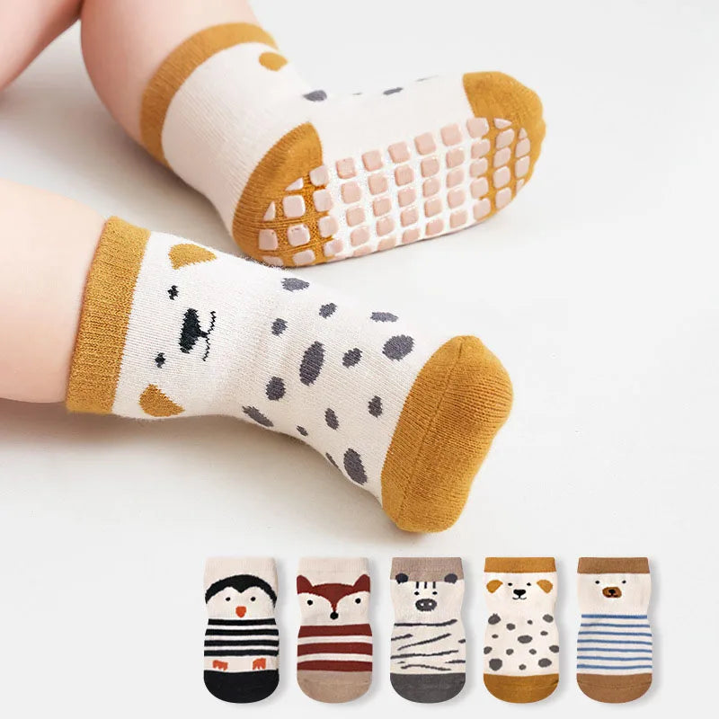 Kids non-slip floor socks on legs, cartoon animal designs with grippy sole pads