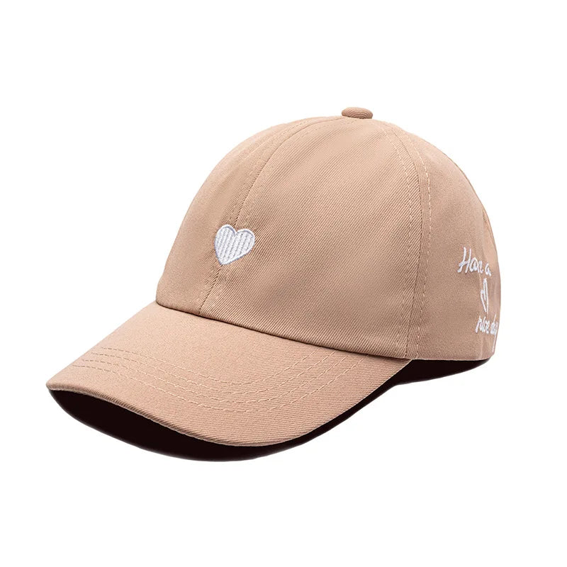 Kids ponytail baseball cap, light tan cotton with heart embroidery