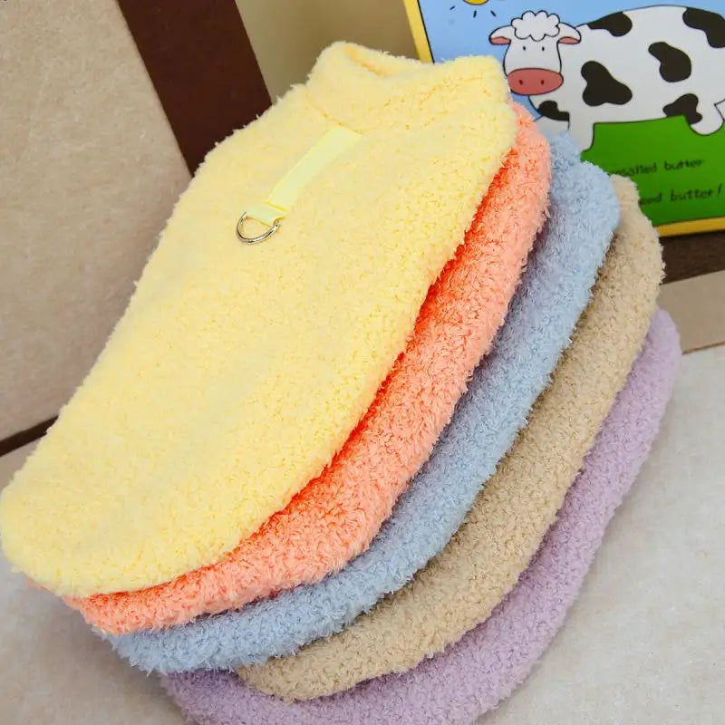 Plush dog sweater with hood and paw cutouts, stacked pastel yellow, orange, blue, and purple