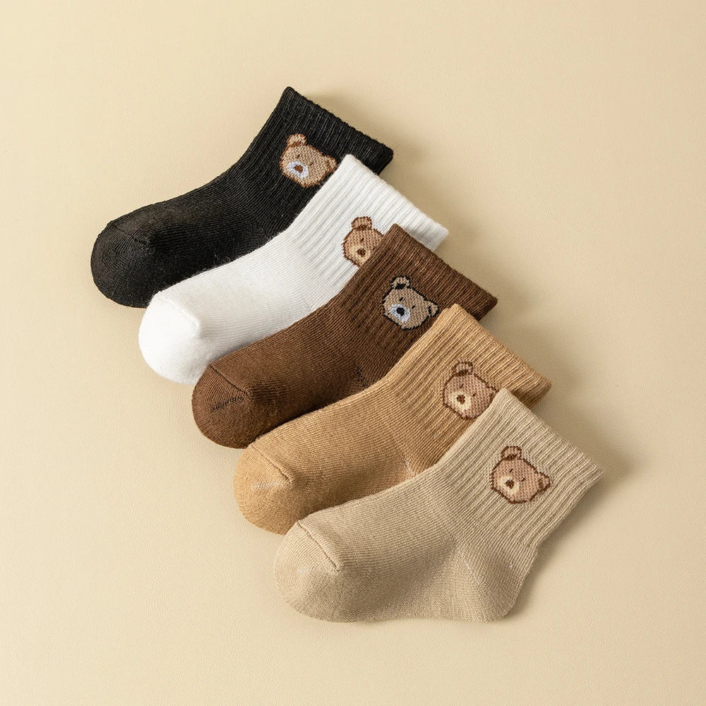 Baby socks with cartoon bear face prints, ribbed cuffs in black, white, brown, tan, cream