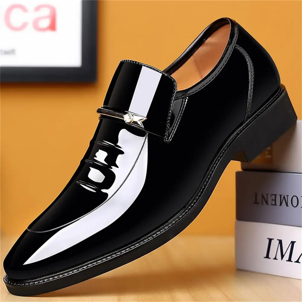 Men's black patent loafer with square buckle strap and pointed toe