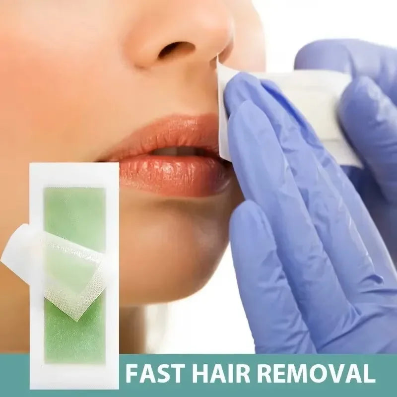 Cold hair removal wax strip applied to face area by blue-gloved hand