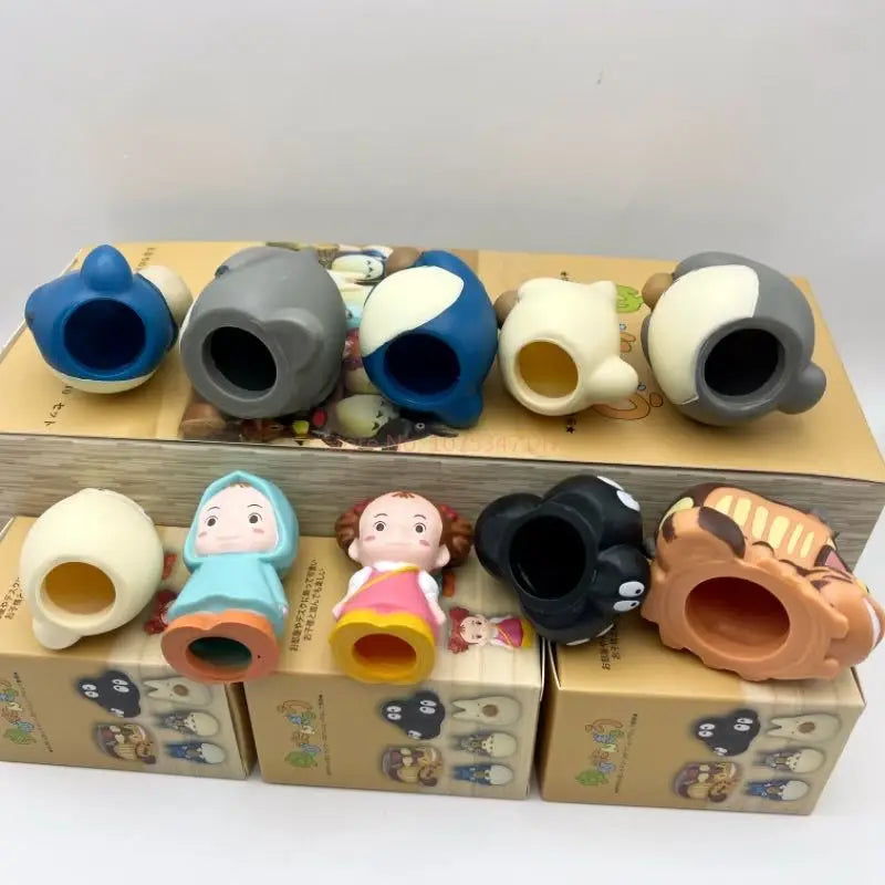 Open blind box packaging tray with colorful character figurine heads