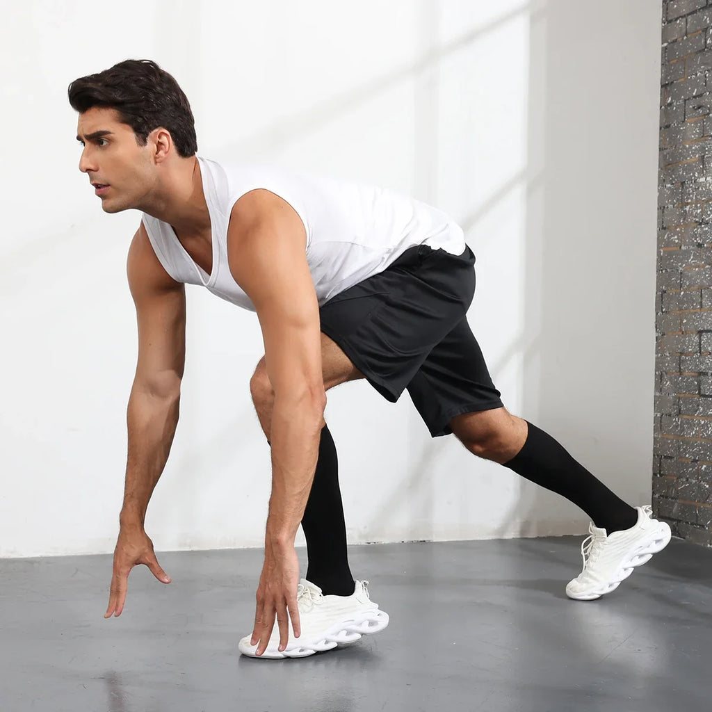 Black knee-high compression socks on legs, ribbed knit over the calf