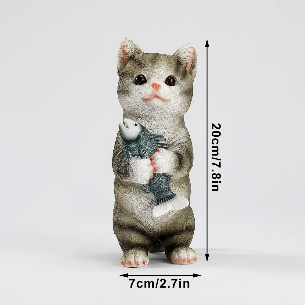 Gray cat figurine holding a gray fish, 20 cm tall and 7 cm wide
