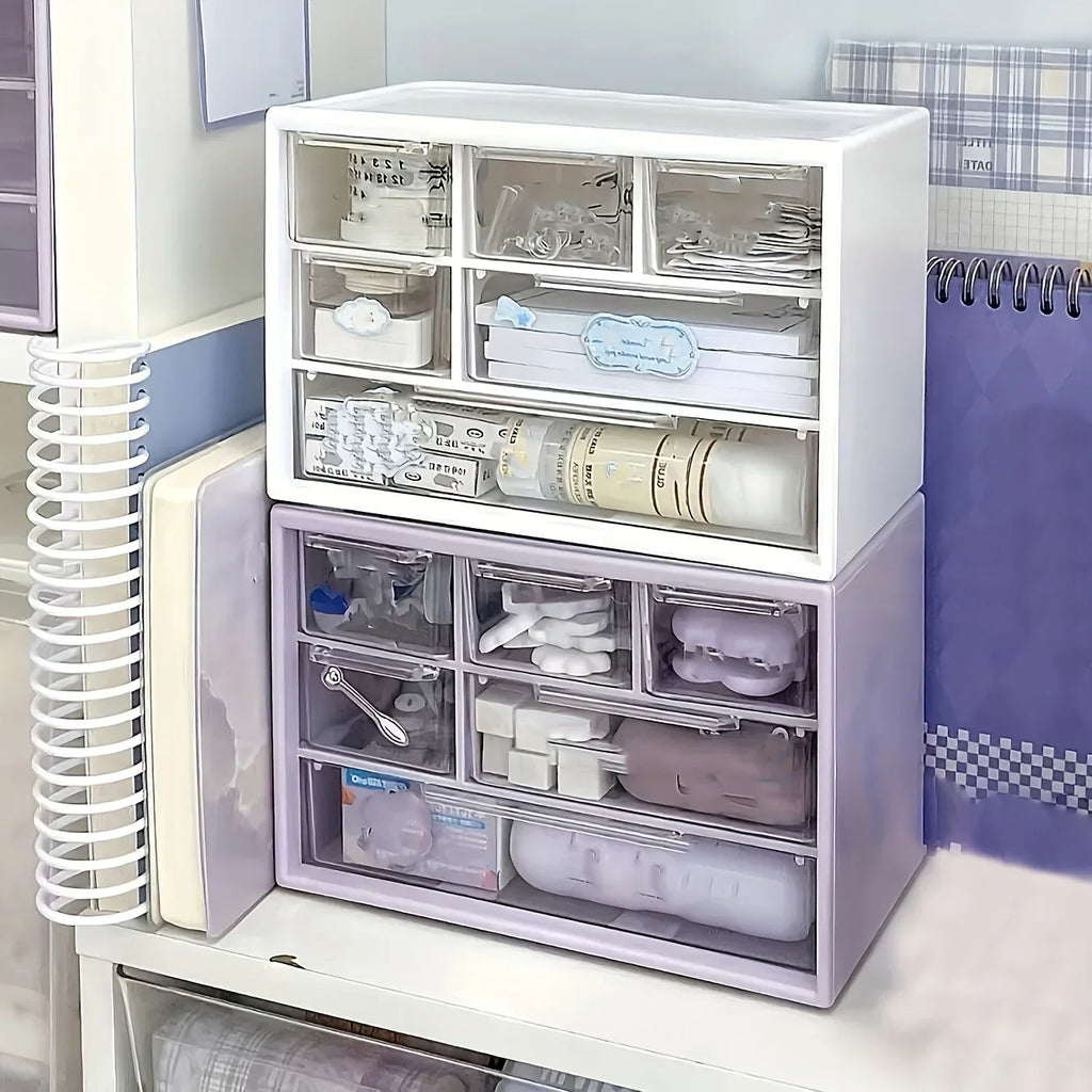 White and purple plastic desk organizer with open drawer compartments for office tools