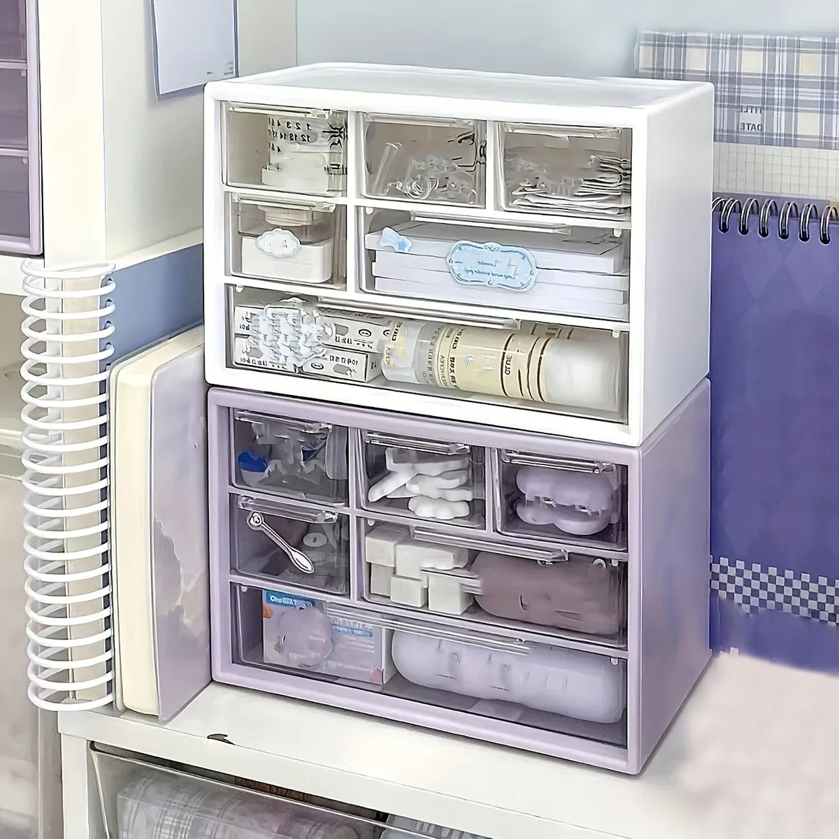White and purple plastic desk organizer with open drawer compartments for office tools