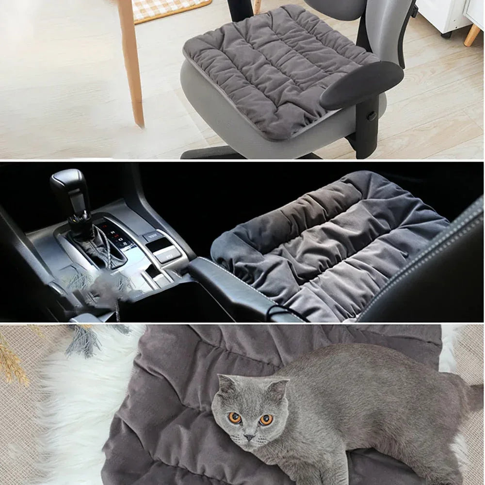 Gray electric heating pad cushion on a chair seat, quilted surface for pet comfort.