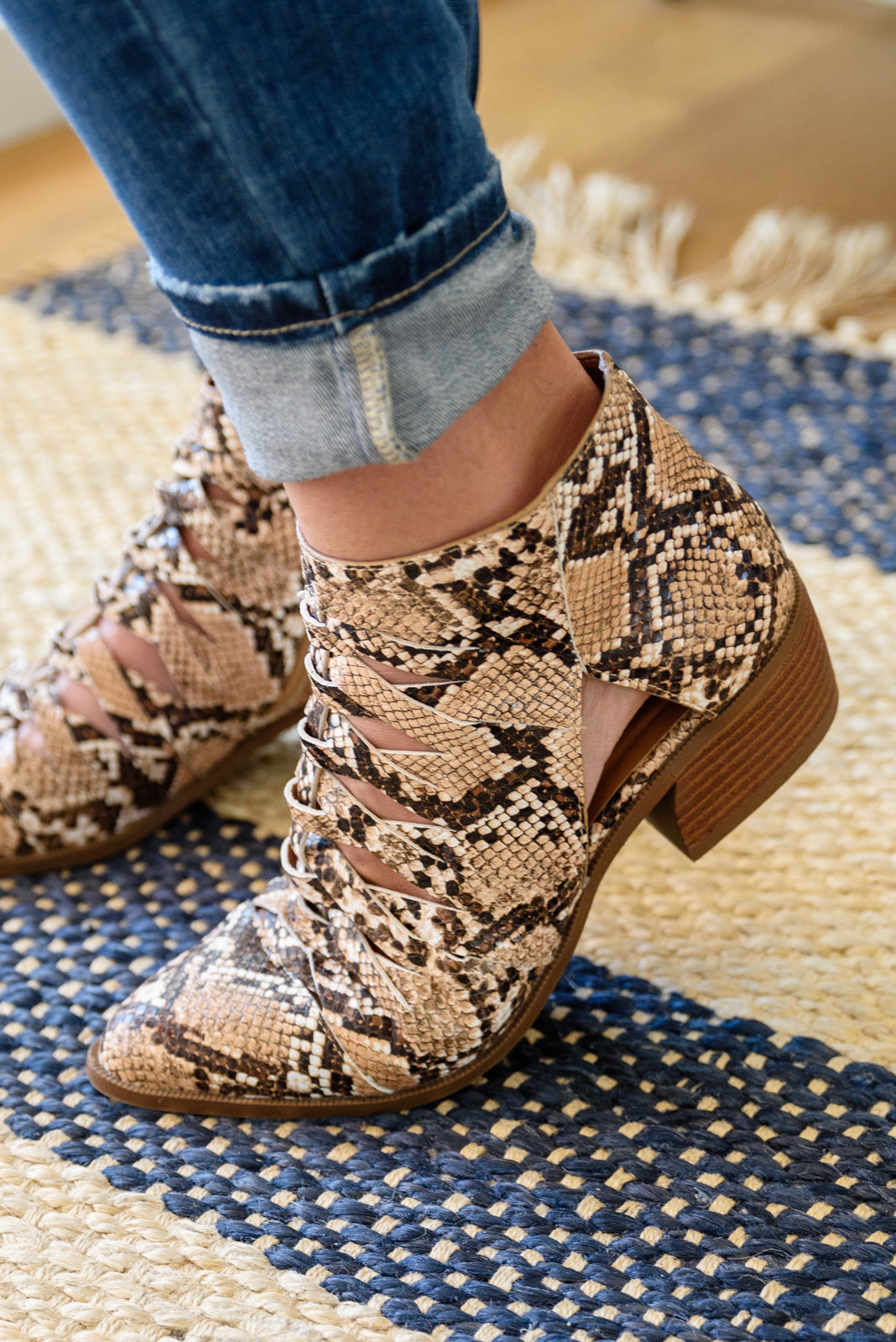Snakeskin-print lace-up ankle boots with medium block heel and pointed toe