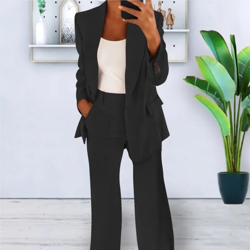 Black two-piece blazer and trousers set, long sleeves, flap pockets, high-waist fit