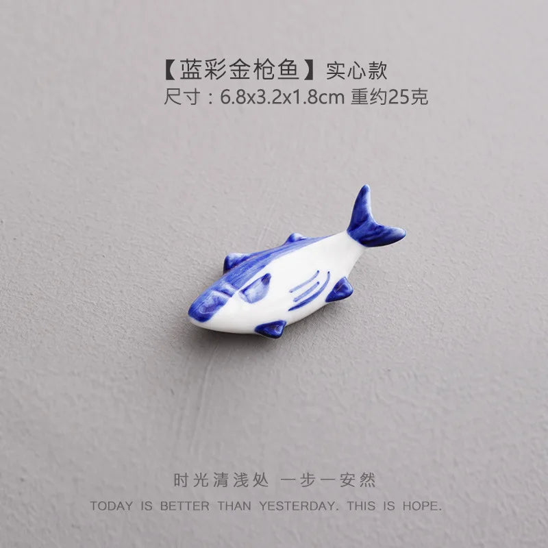 Single ceramic fish chopstick holder, blue and white glazed fish design