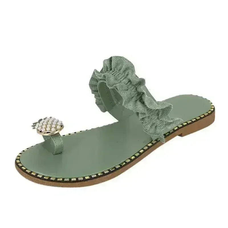 Sage green flat slide sandal with pearl pineapple charm and gathered ruffle