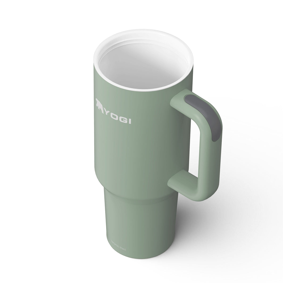 Ceramic-lined tumbler in sage green with side handle and white interior