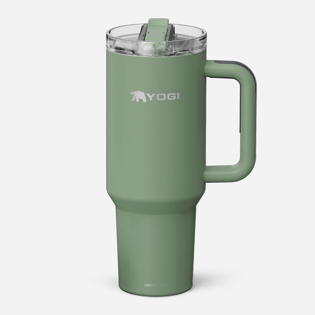 Ceramic-lined tumbler in sage green with side handle and clear sip lid