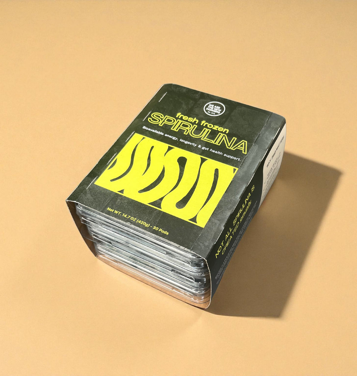 Fresh frozen spirulina pods box, sealed with green and yellow label