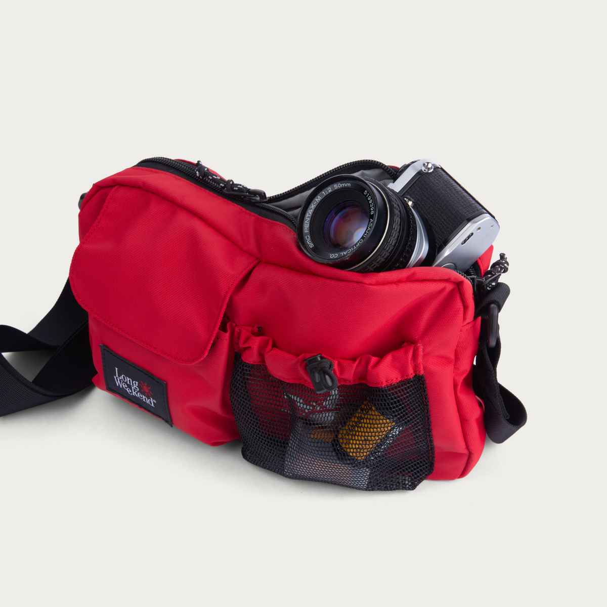 Red camera shoulder bag with mesh pocket and front zip compartments, Long Weekend patch