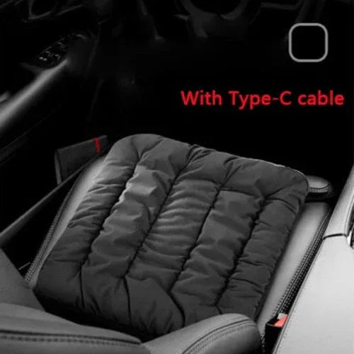 Gray electric heating cushion pad placed on car seat with connected power cable.