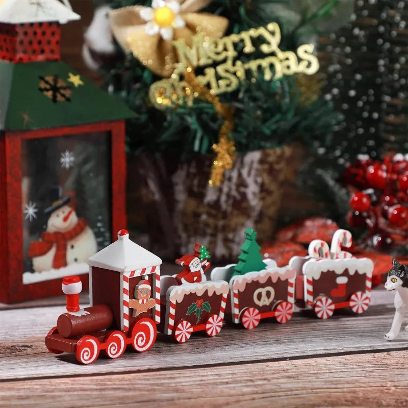 Red and green painted wooden Christmas train set with multiple cars and snowman details